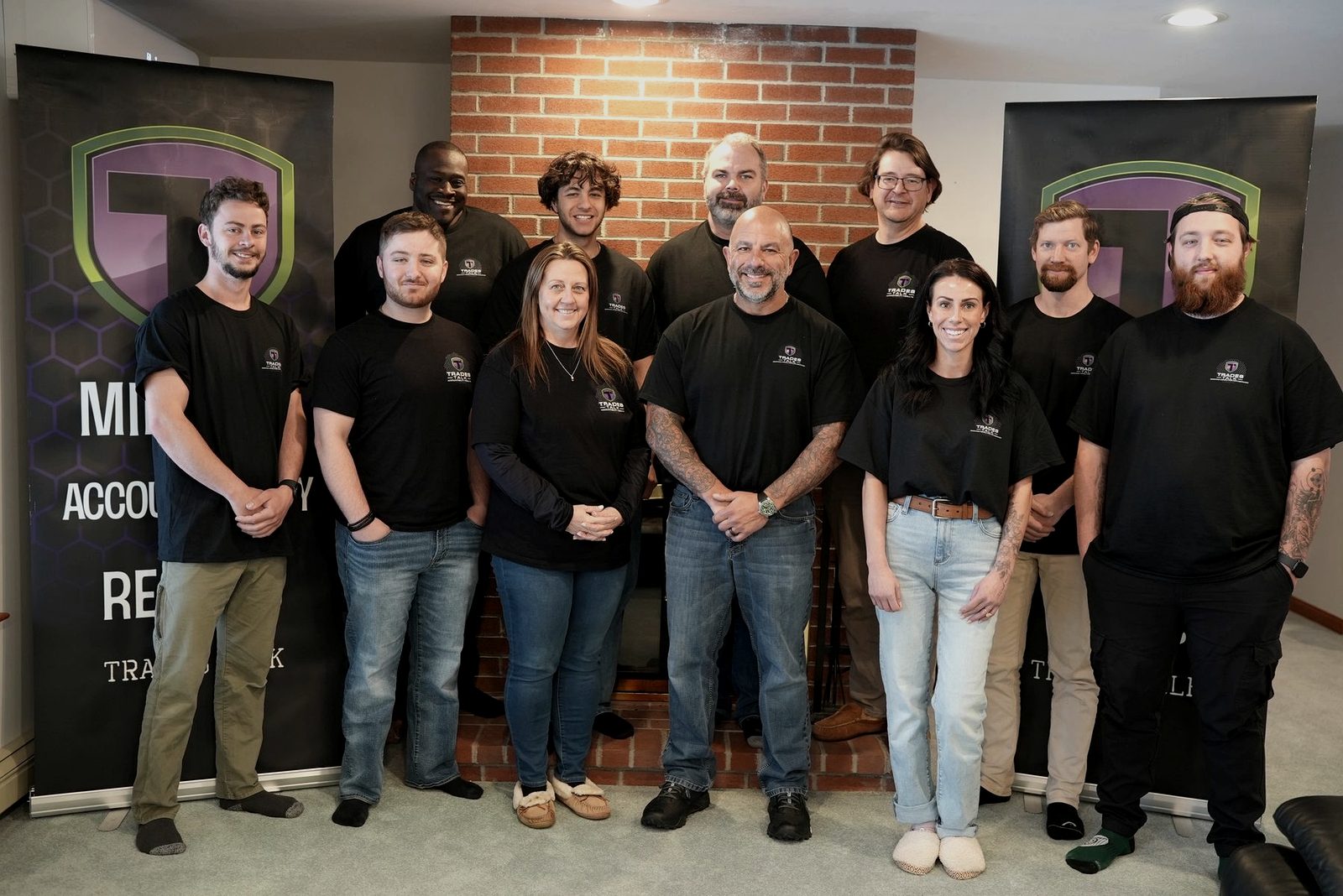 Cornerstone Code graduates with Trades Talk banners